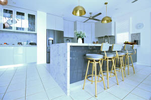 Butlers sink with gold tapware