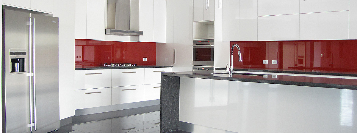 Designer kitchen with red splashback